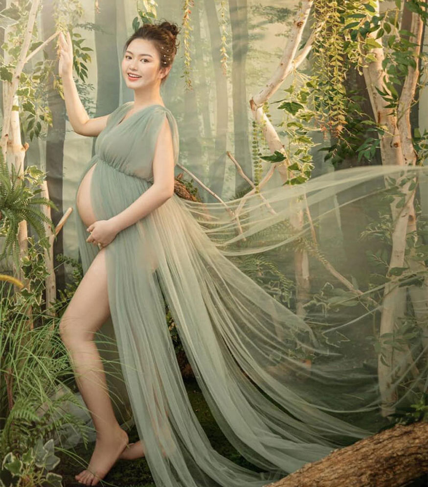 Concept of taking maternity photos with lingerie and silk fabric.